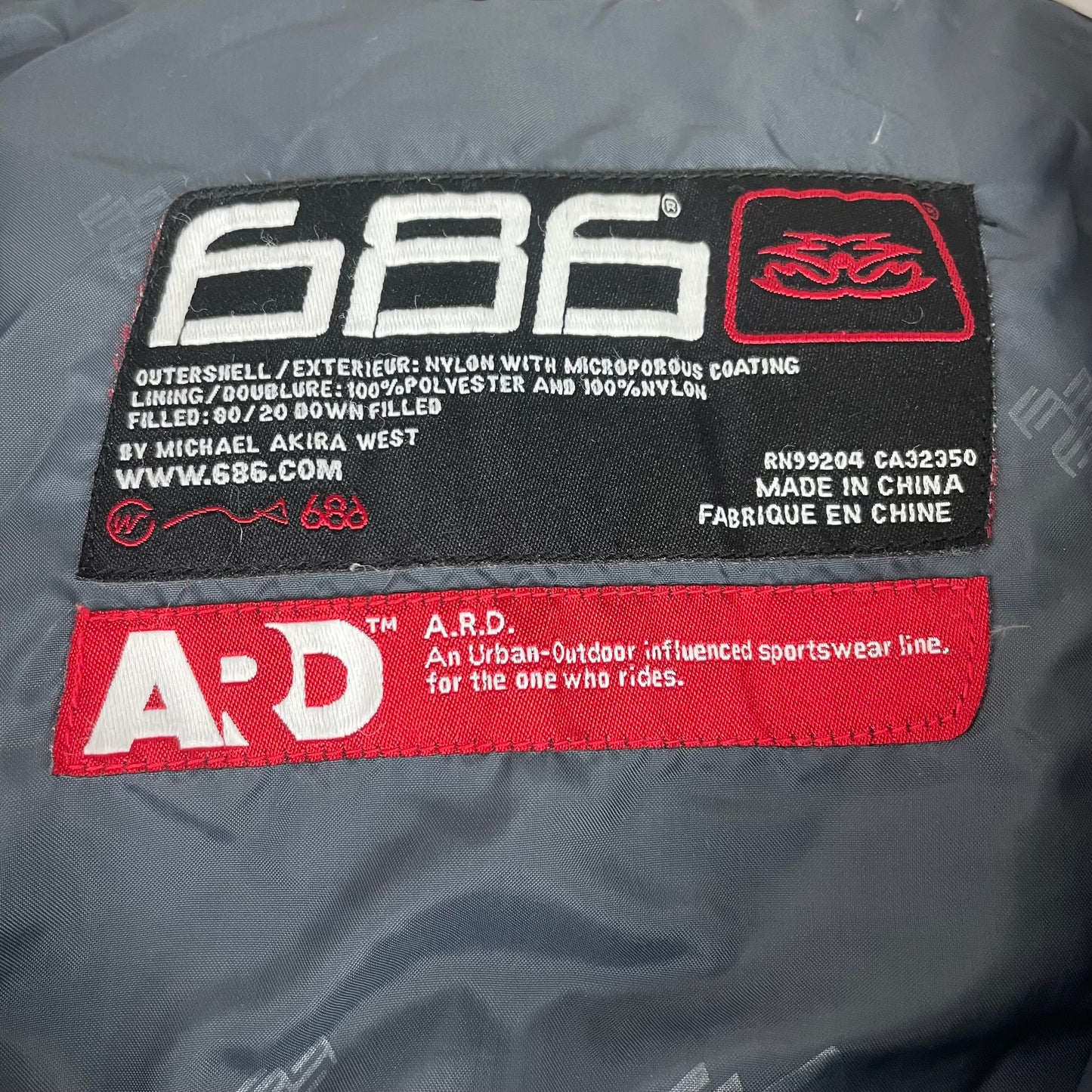 686 Men's Black All-Over Logo Print Puffer Jacket
